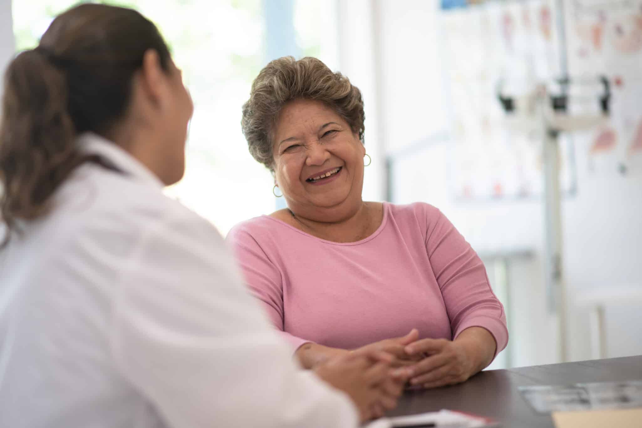 Older Woman talking with the Doctor stock photo